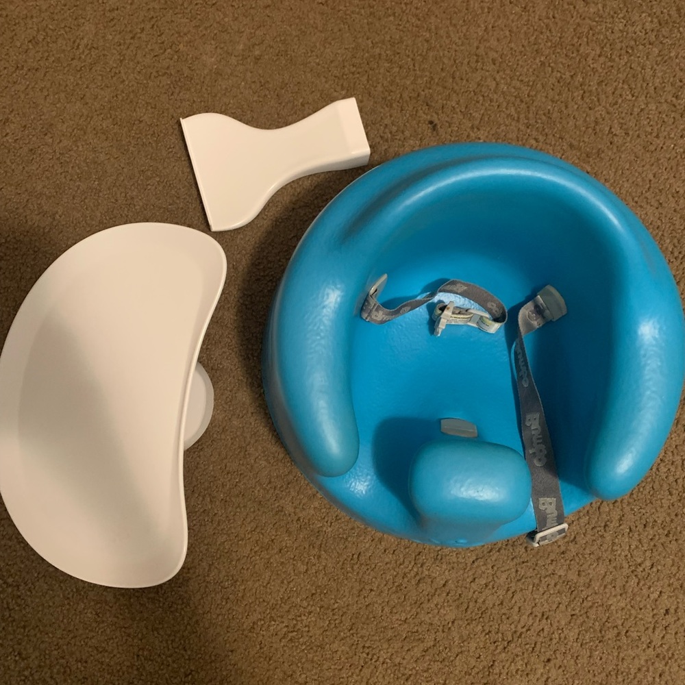 Blue bumbo seat with tray and tray stand